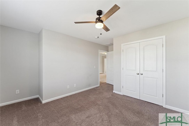 unfurnished bedroom featuring ceiling fan, carpet flooring, and a closet