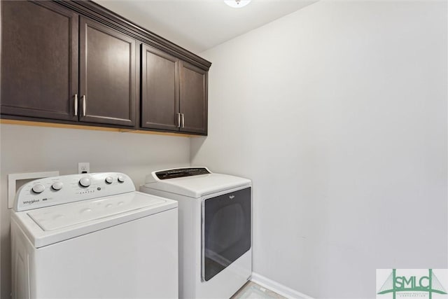 laundry room featuring cabinets and independent washer and dryer