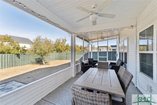 sunroom / solarium with ceiling fan