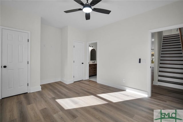 interior space with ceiling fan and hardwood / wood-style floors