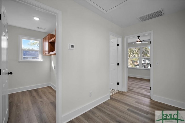 corridor featuring light hardwood / wood-style floors