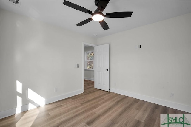 unfurnished room featuring ceiling fan and light wood-type flooring