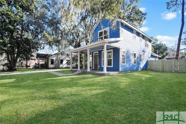 view of front of property with a porch and a front lawn