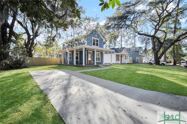 view of front of property featuring a front yard and a porch