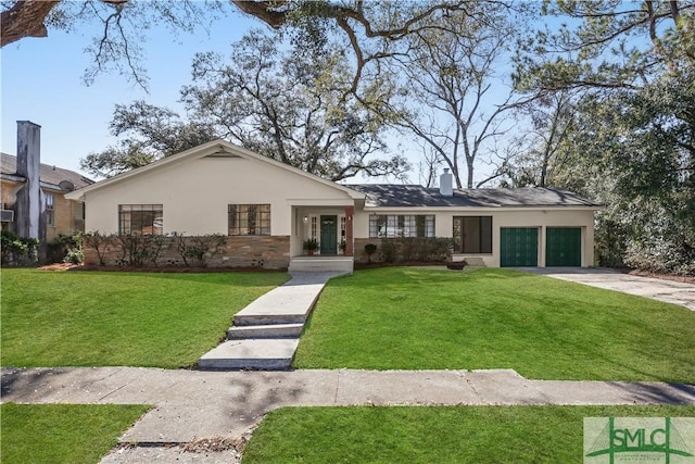 ranch-style house featuring a garage and a front yard