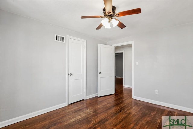 unfurnished bedroom featuring dark hardwood / wood-style flooring and ceiling fan