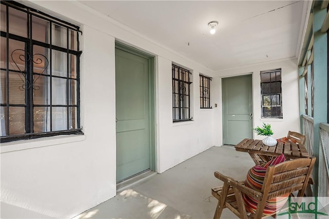 doorway to property with a porch