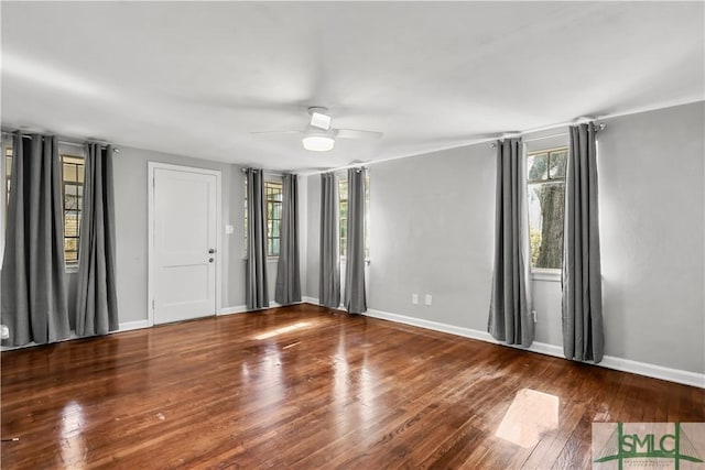 unfurnished room with hardwood / wood-style flooring and ceiling fan