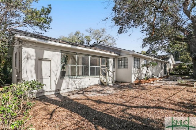 back of house with a sunroom