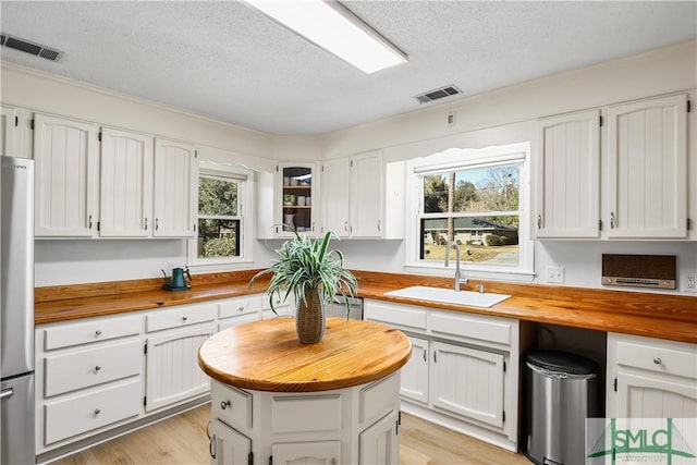 kitchen featuring sink and white cabinets