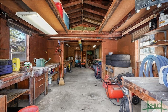 misc room featuring concrete floors and a workshop area