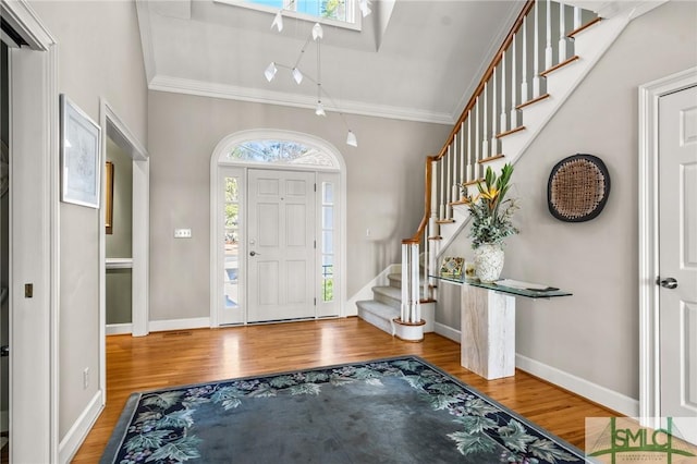 1 Bishopwood Ct, Savannah, GA 31411 - foyer entrance featuring ornamental molding, wood finished floors, stairway, and baseboards
