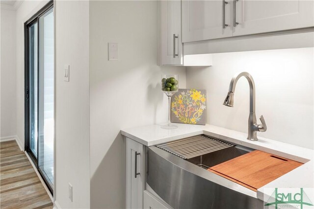 kitchen with sink and light wood-type flooring