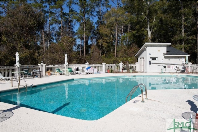 view of swimming pool with a patio area