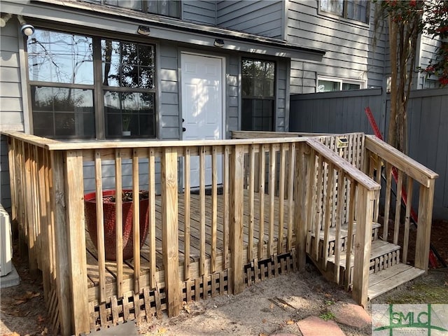 property entrance with a deck