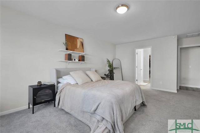 carpeted bedroom featuring connected bathroom