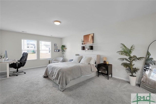 bedroom featuring light colored carpet