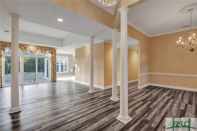 unfurnished living room featuring crown molding, decorative columns, dark hardwood / wood-style floors, and a chandelier