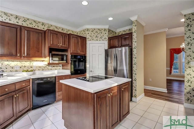 kitchen with light tile patterned floors, crown molding, sink, black appliances, and a kitchen island