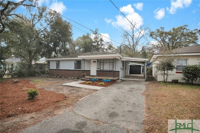 view of front of house with a garage and covered porch