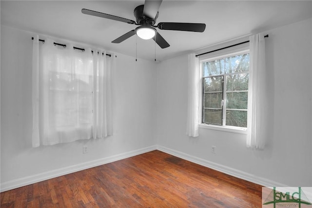 spare room with hardwood / wood-style flooring and ceiling fan