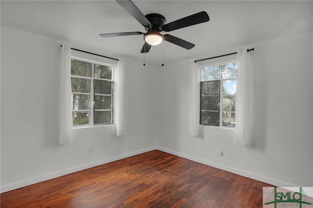 spare room with dark hardwood / wood-style flooring