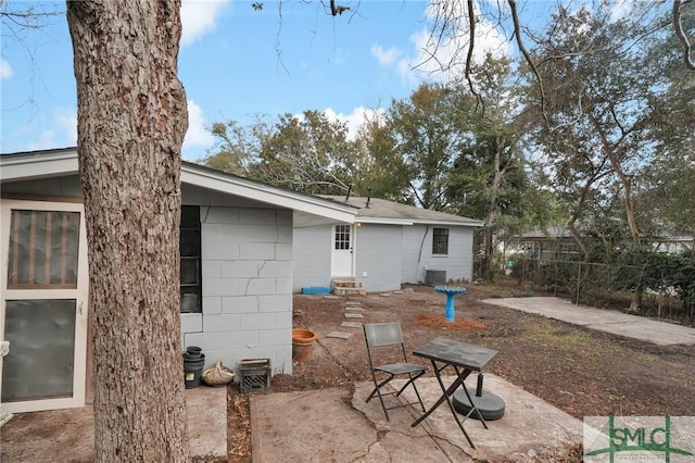 back of property with a patio