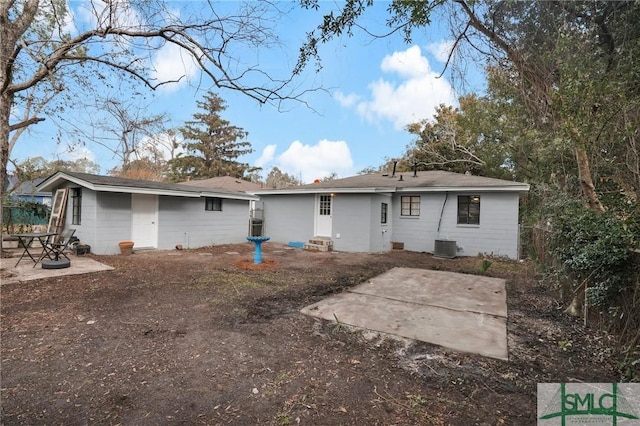 back of house with a patio area and central air condition unit