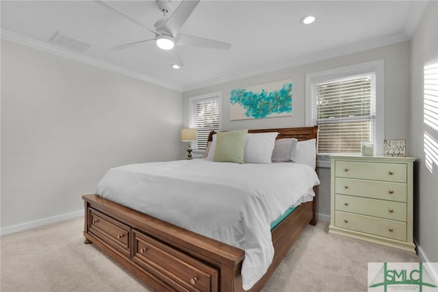 bedroom featuring crown molding, light colored carpet, and ceiling fan