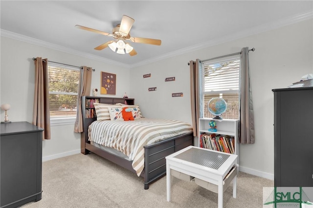 bedroom featuring light colored carpet, ornamental molding, and ceiling fan