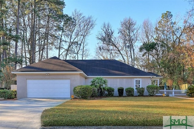 single story home with a garage and a front lawn