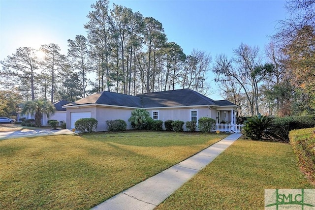 ranch-style home featuring a garage and a front lawn