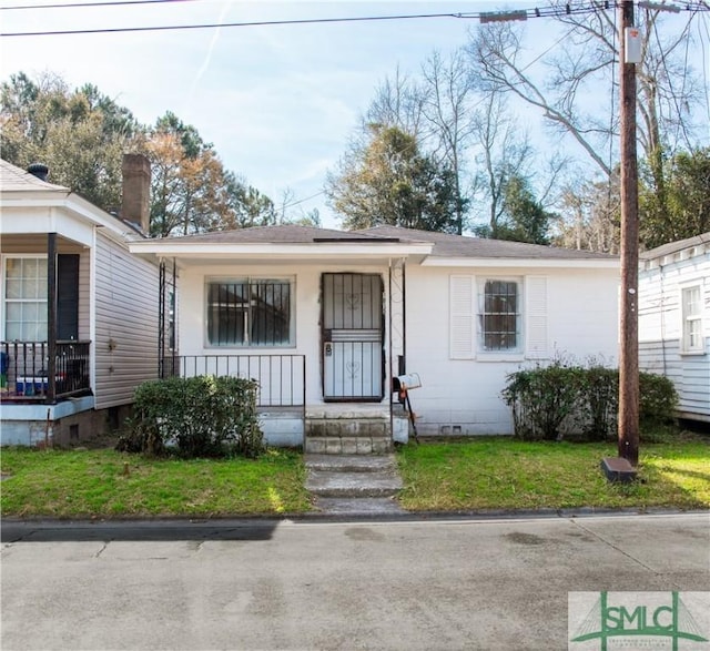 view of front facade with a porch and a front yard