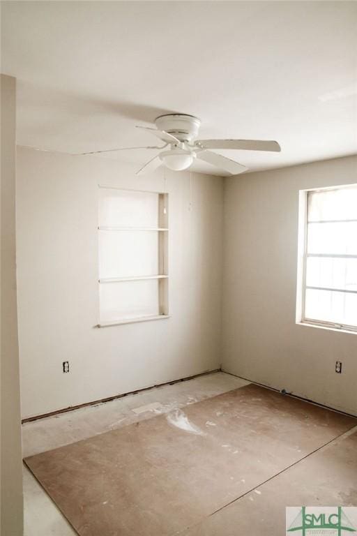 unfurnished room with ceiling fan