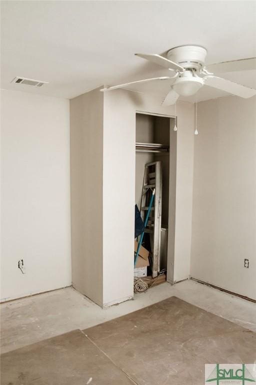 interior space featuring concrete floors and ceiling fan