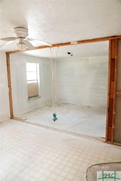 unfurnished room with ceiling fan