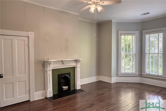 unfurnished living room featuring dark wood-type flooring, ceiling fan, and crown molding