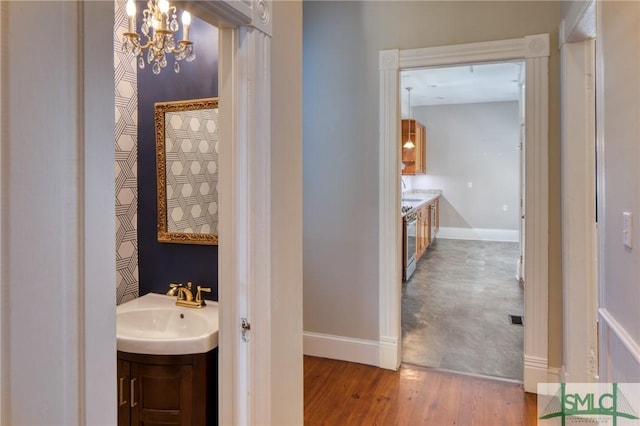 bathroom featuring vanity and wood-type flooring