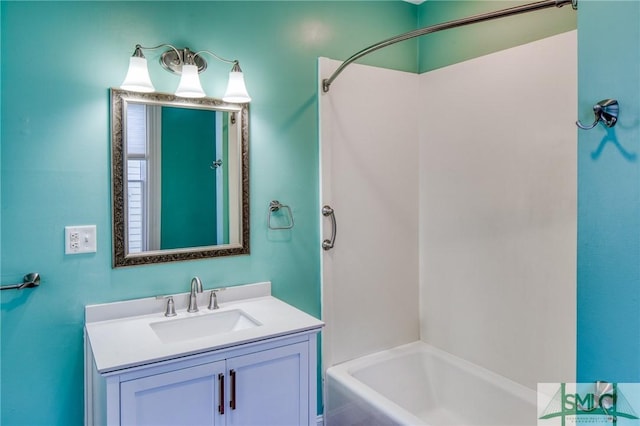 bathroom with vanity and bathing tub / shower combination