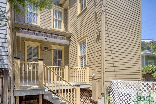 view of exterior entry with ceiling fan