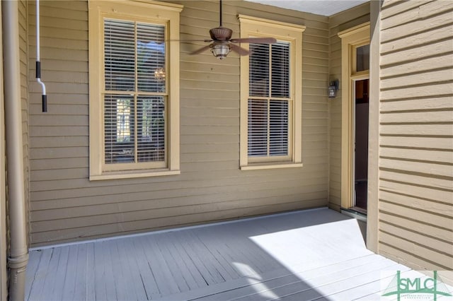 wooden deck with ceiling fan