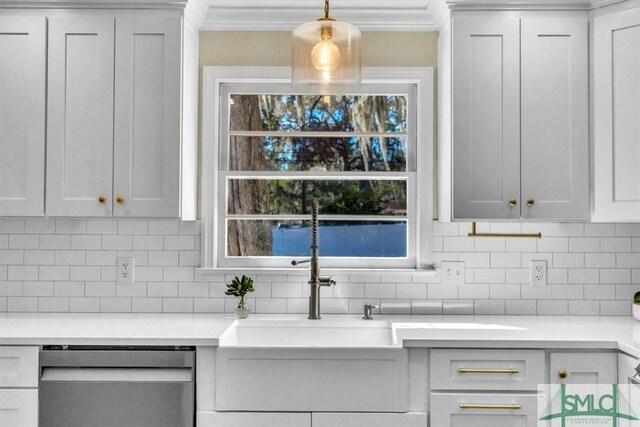 kitchen featuring pendant lighting, dishwasher, tasteful backsplash, and white cabinets