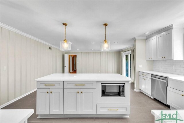 kitchen featuring stainless steel appliances, pendant lighting, and white cabinets