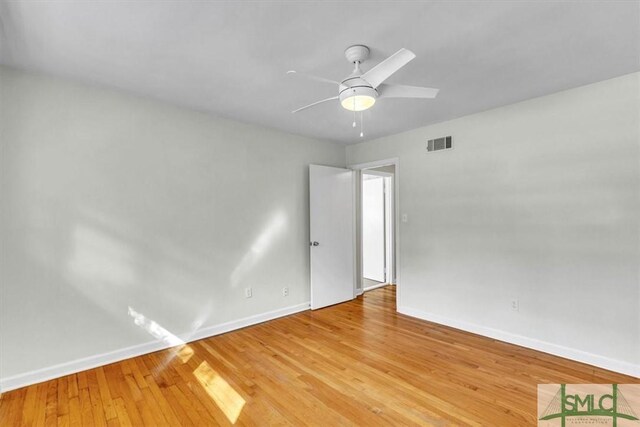 empty room featuring ceiling fan and light wood-type flooring