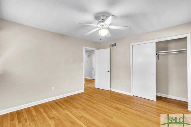 unfurnished bedroom with a closet, ceiling fan, and light wood-type flooring