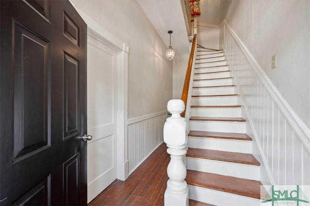 stairway with hardwood / wood-style floors