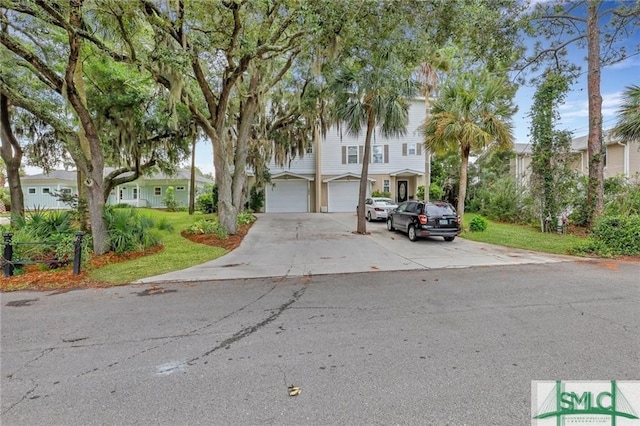 view of front of property featuring driveway and a residential view