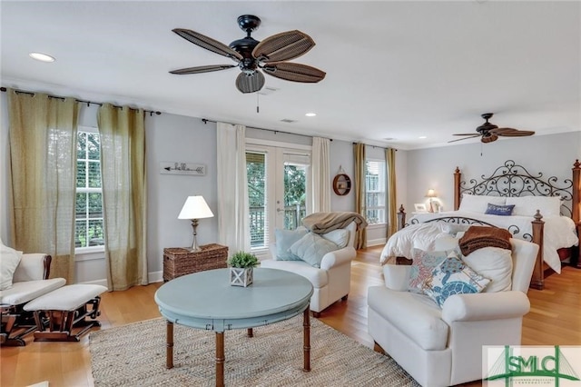 bedroom with french doors, ceiling fan, access to outside, and light wood-type flooring