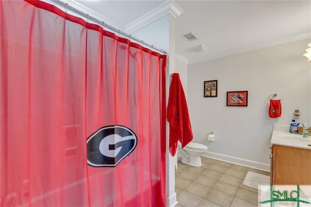 bathroom featuring vanity, tile patterned flooring, crown molding, and toilet