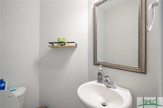 bathroom with sink and toilet